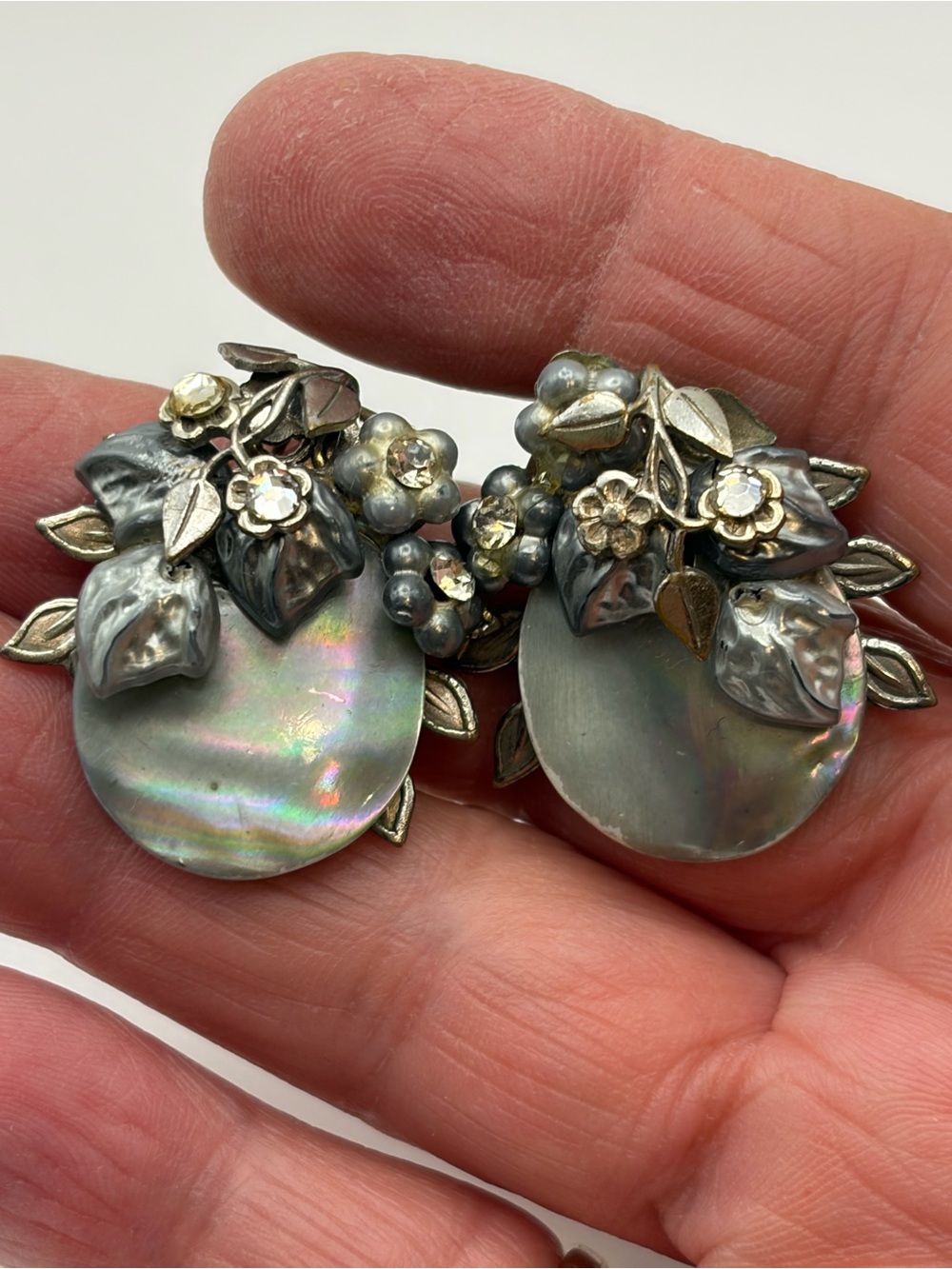 Vintage 1950s gray mother of pearl and rhinestone floral clip on earrings